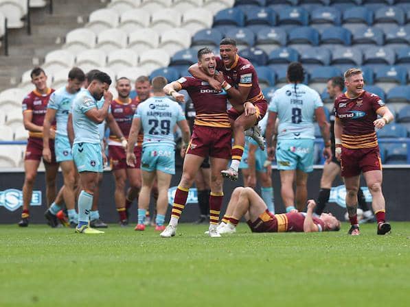 Misery for Trinity as Sam Wood and Will Pryce celebrate Giants' winning try. Paul Currie/SWpix.com