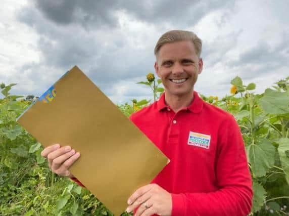 Jeff Brazier with the winning envelope.