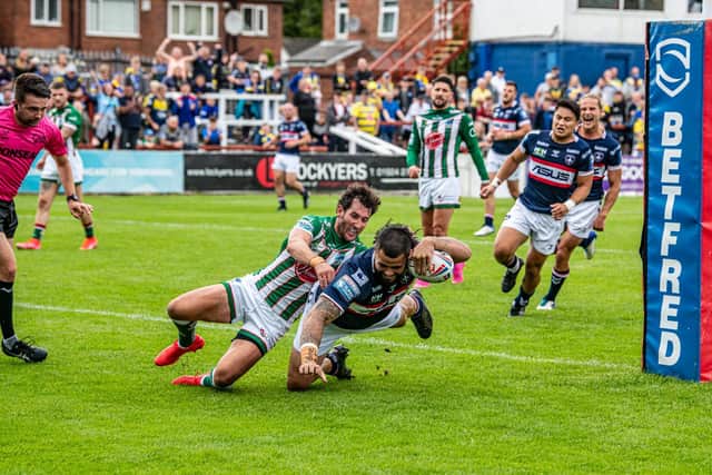 Dave Fifita scores Trinity's second try in the win over Warrington. Picture by Tony Johnson.