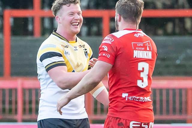 Picture by Allan McKenzie/SWpix.com - 14/03/2021 - Rugby League - Adam Milner Testimonial - Hull KR v Castleford Tigers - Hull College Craven Park, Hull, England - Adam Milner is congratulated by Greg Minikin of Hull KR after his testimonial comes to a close.