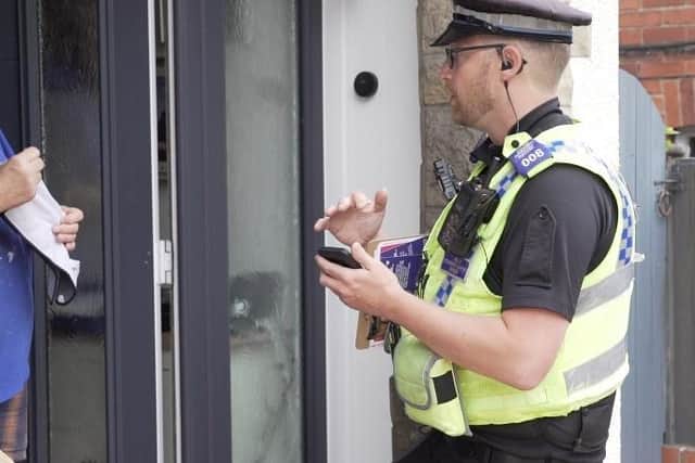 Police have been knocking on doors to speak with residents. (library pic)