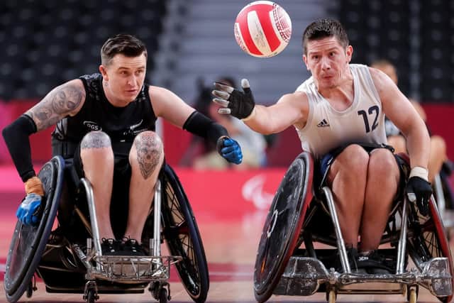 TOKYO, JAPAN - AUGUST 26: Jamie Stead #12 of Team Great Britain reaches for a loose ball ahead of Cody Everson #14 of Team New Zealand during the Wheelchair Rugby Pool Phase Group B game on day 2 of the Tokyo 2020 Paralympic Games at Yoyogi National Stadium on August 26, 2021 in Tokyo, Japan. (Photo by Carmen Mandato/Getty Images)