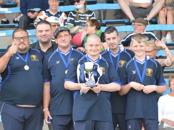 Featherstone Rovers Learning Disability Rugby Team with their trophy.