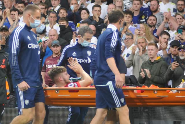 Liverpool youngster Harvey Elliott shows his appreciation for Leeds United fans after they applauded him as he was carried off on a stretcher.