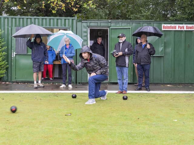 Not quite a beautiful late summer's morning, but bowling club members still held a taster session at the park on Tuesday morning.