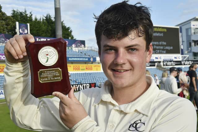 Castleford's 17-year-old man of the match Jack Young shows off the trophy he won as player of the Yorkshire Premier League final after taking five Woodlands wickets. Picture: Steve Riding
