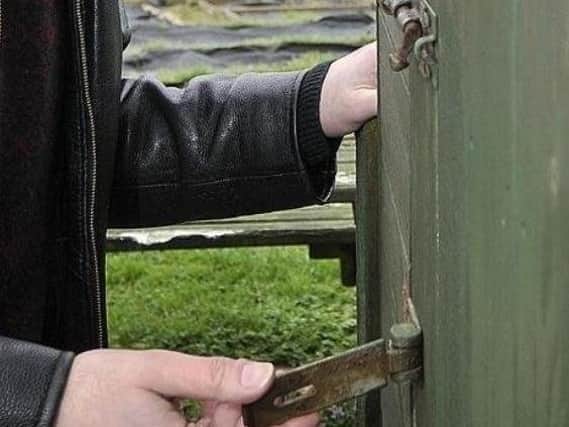 The shed door was forced open by the thieves.