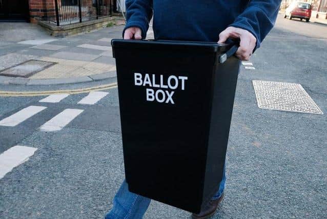 A ballot box arrives at an election count.
