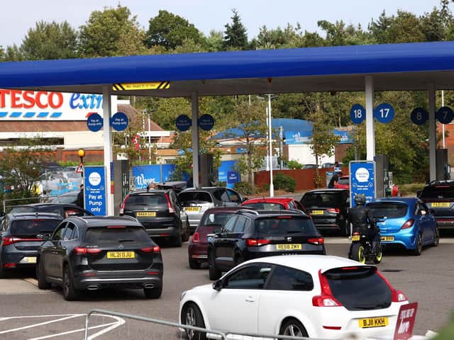 QUEUES: A line of vehicles waiting to fill up at a Tesco. Photo: Getty Images