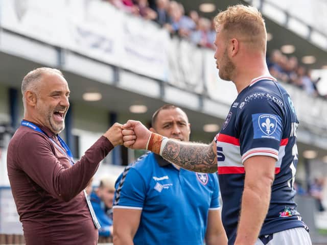 Picture by Allan McKenzie/SWpix.com - 15/08/2021 - Rugby League - Betfred Super League Round 19 - Wakefield Trinity v Warrington Wolves - Beaumont Legal Stadium, Wakefield, England - Wakefield's owner Michael Carter congratulates JoeWesterman after their side's victory over Warrington.