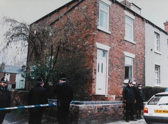 Officers at Mrs Speakes home on Balne Lane, Wakefield, where the murder took place.