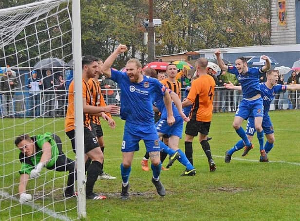 Pontefract Collieries players celebrate as one of their six goals goes into the net in the FA Cup tie against Handsworth. Picture: @dribblingcode