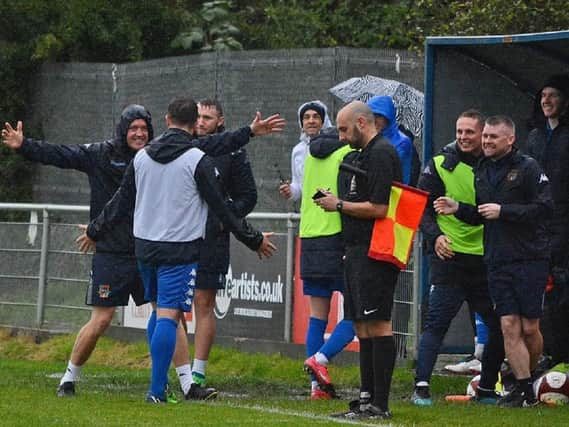 Pontefract Collieries manager Craig Rouse celebrates on the sidelines during his side's fantastic FA Cup win over Handsworth. Picture: @dribblingcode