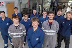 Apprentice body shop technician Josh Waring (centre front) with some of the other Pelican Engineering apprentices.
