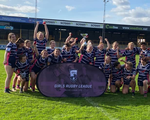 Featherstone Lionesses U16s celebrate after winning the War of Roses final against Orrell St James.