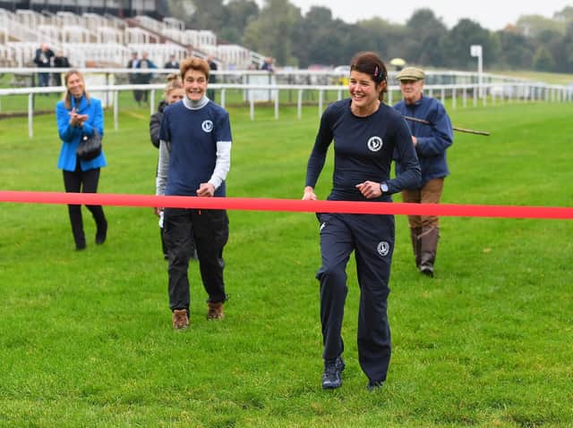 Harriet Bethell completes a charity walk round Pontefract Racecourse in aid of the Injured Jockeys Fund. Picture: Alan Wright