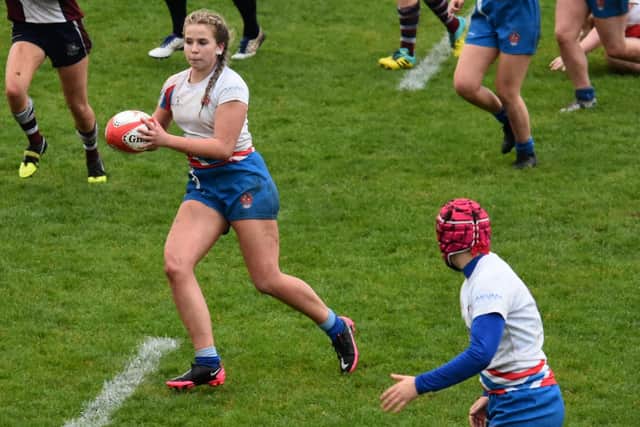 Emily Heaps about to release Tally Bryer in Castleford RUFC U18s' game at Scarborough. Picture: Richard Gould
