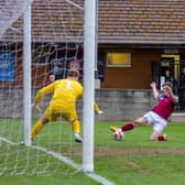 Jack Bennett beats the Longridge Town goalkeeper to the ball to score Emley's fourth goal. Picture: Mark Parsons