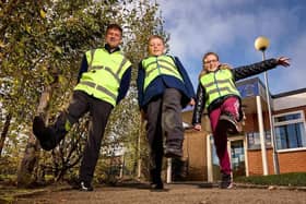 Year 6 Pupils from Rooks Nest Academy, pictured with Chris Carlin of Miller Homes, get Home Safe thanks to the donation of hi-vis vests from the housebuilder.
