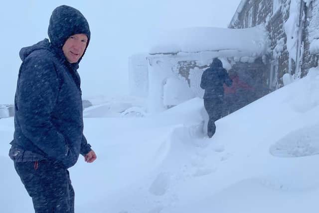 Martin Overton braving the weather at Britain's highest pub.