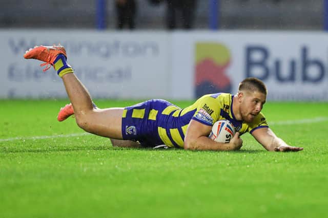 Picture by Paul Currie/SWpix.com - 24/06/2021 - Rugby League - Betfred Super League Round 11 - Warrington Wolves v Leigh Centurions - Halliwell Jones Stadium, Warrington, England - Warrington Wolves' Tom Lineham runs the whole length of the pitch to score a try
