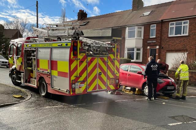 A fire crew from Ossett rescued  Reggie the cat from underneath a car.