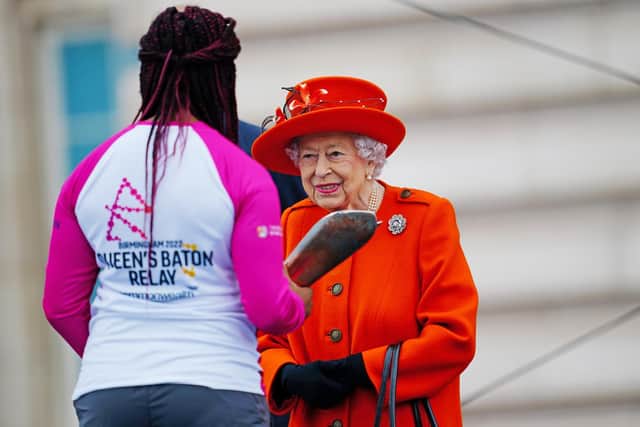 Leeds Paralympian Kadeena Cox has been awarded an MBE in the New Year's Honours List 2022. She is pictured with Queen Elizabeth II at the launch of the Queen's Baton Relay for Birmingham 2022 - the XXII Commonwealth Games (Photo: Victoria Jones/PA Wire)