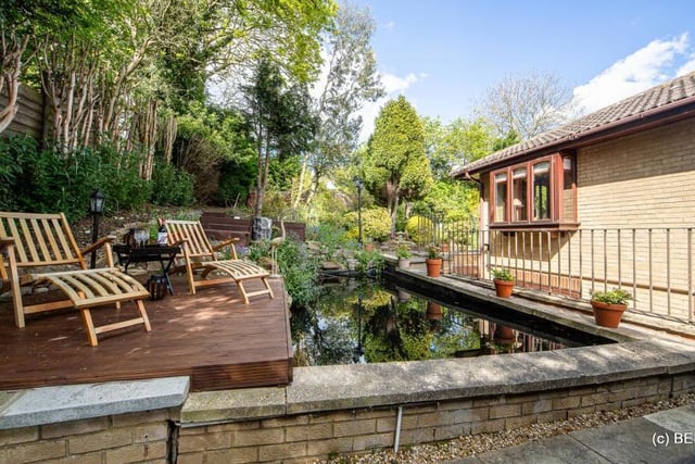 Outdoors boasts a patio, permanent barbecue station, landscaped gardens and tranquil pond