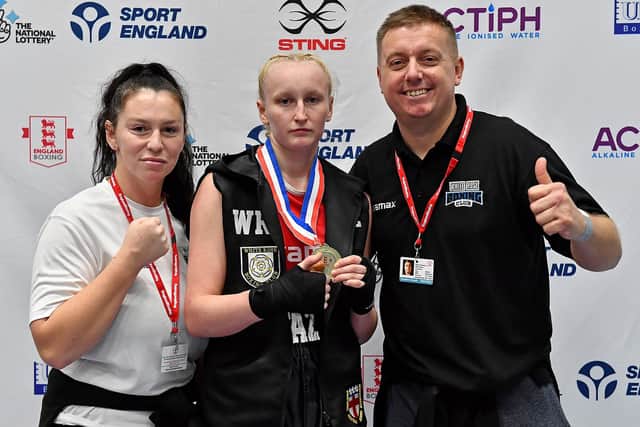 White Rose Boxing coaches Sherri Walker and Shaun Roberts with Farrah Cunniff.