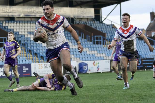 Mathieu Cozza races over for a Wakefield Trinity try. Picture: Kevin Creighton