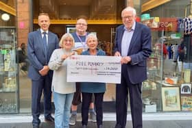 Coun Maureen Cummings, Anthony Sadler,  from Wakefield Council and the Foundation's Executive Director, Murray Edwards with two volunteers from the Community Give Box, the Foundation's retail arm.