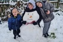 These three siblings enjoyed making a snowmen together, submitted by Kellie Wright