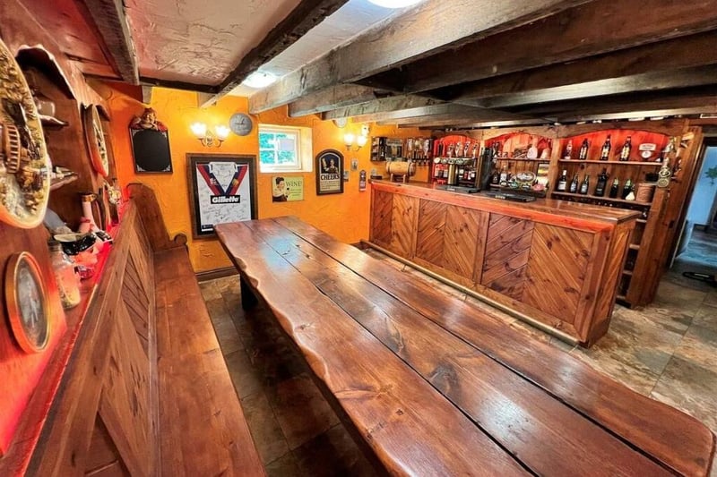 The basement bar, with bench table and seating.