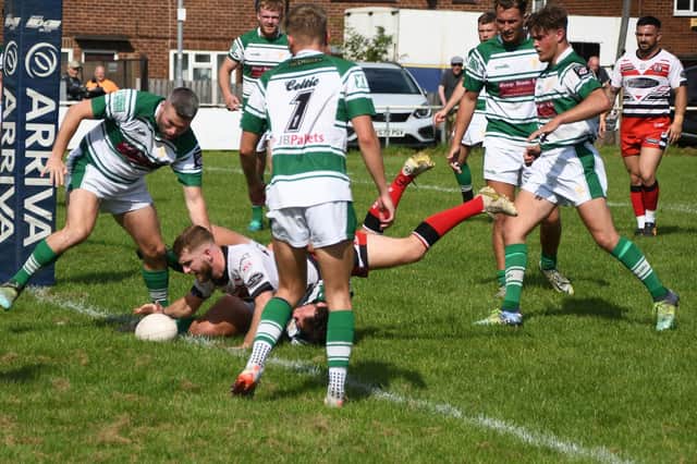 Kieran Hinchcliffe grounds the ball for a try for Normanton Knights against Dewsbury Celtic. Photo by Rob Hare