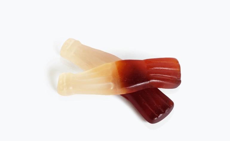 Giant cola bottles - shaped just like a traditional cola bottles and come in a delicious cola flavour.