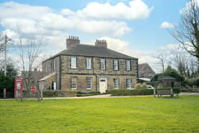 The impressive property stands in a prime spot overlooking the village green.