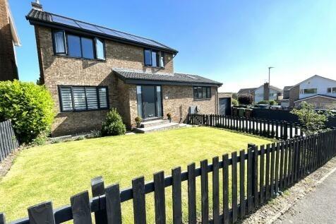 This home on Churchill Grove is availble for offers around £475,000.