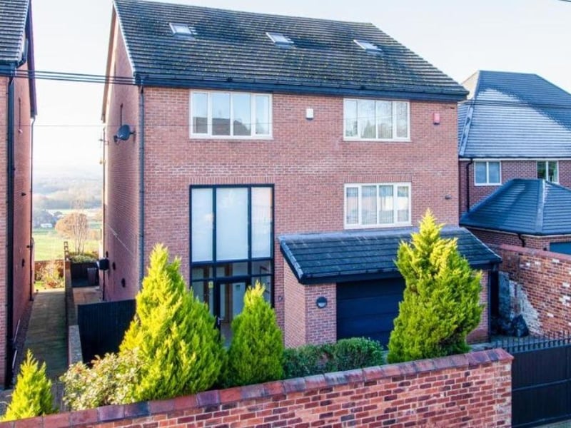 On the market for £995,000 with Hallmark from Richard Kendall, Wakefield, this six bedroom property is described as a "modern accommodation on a grand scale, sits this exceptionally large detached family home, with breath-taking views to the rear and six double bedrooms."