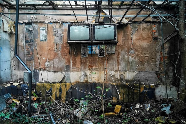 Despite being vandalised, the big TVs are still attached to the walls.