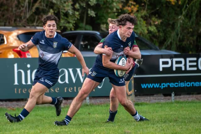Tom Papworth shows his strength to score. Pic: Jonathan Buck