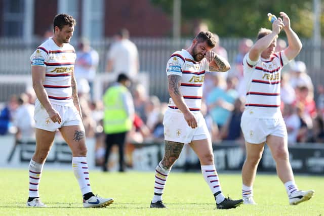 Disappointed Wakefield Trinity players at the end of their game against St Helens. Photo by John Clifton/SWpix.com