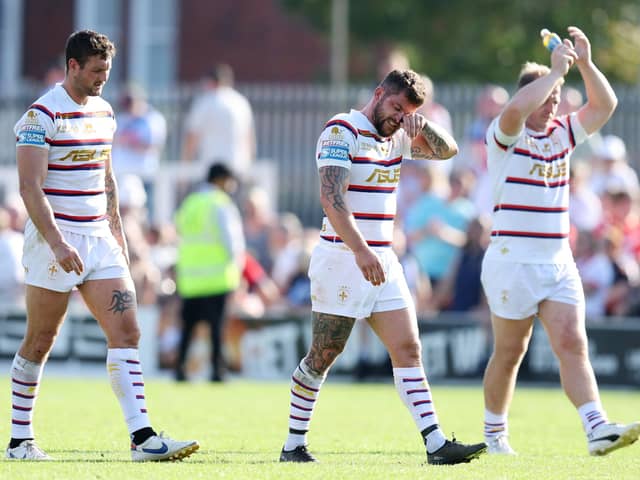 Disappointed Wakefield Trinity players at the end of their game against St Helens. Photo by John Clifton/SWpix.com