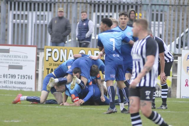 Wakefield AFC players celebrate the goal against their title challengers Swinton that put them on course for promotion in 2022.