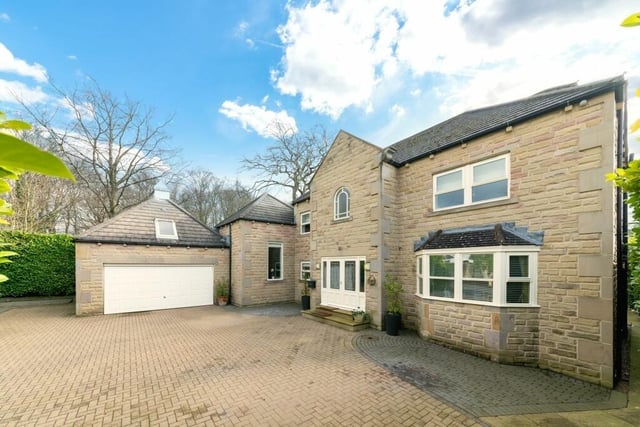 A front view of the family home for sale in Woodthorpe Manor.