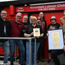 Wakefield Labour Club officers and beer festival management with the plaque. Current club president Matthew Hallas is holding the plaque.
