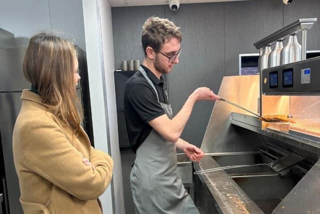 Jack showed his local MP how to wrap a chippy tea during her visit.