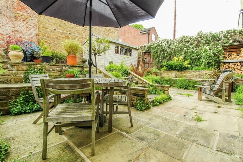 The property benefits from a gorgeous large walled courtyard garden, on multiple levels, with stone paved seating areas.
