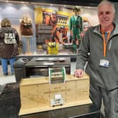 Volunteer Ian Guest with his model mine car tippler. Ian used to work as an electrician and in computing for British Coal. He creates designs on a computer which are then cut out using a laser cutter and 3D printer to make models of mining machinery to aid visitor understanding