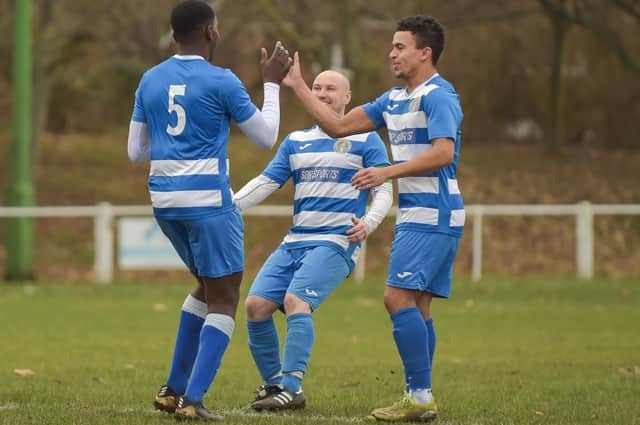 Freddy Bernard celebrates his first goal against Athersley Recreation with Glasshoughton Welfare teammates.