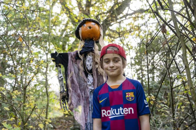 Alfie Yoxall spotting scarecrows at the Hallowe'en scarecrow trail at Anglers Country Park.